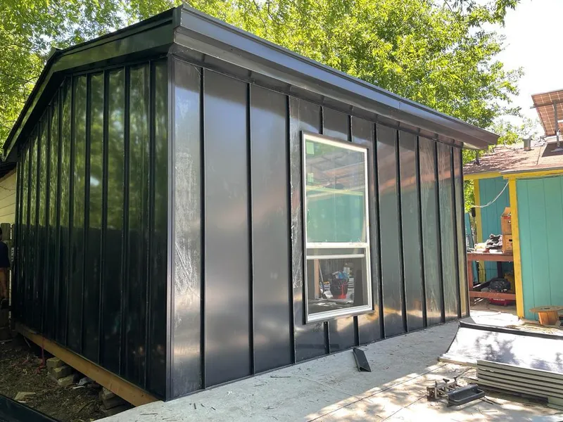 Black standing seam metal wall panels for Roof Inspection in Brownville