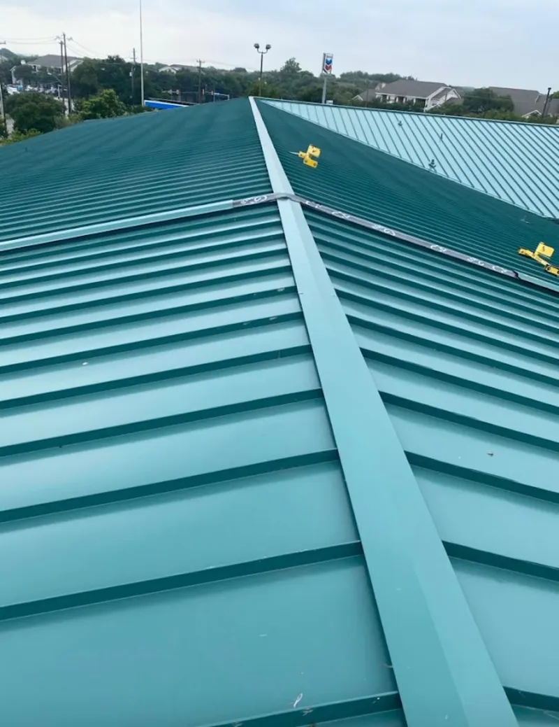Green commercial metal roof ridge and valley for Metal Roof Repair in Brownville